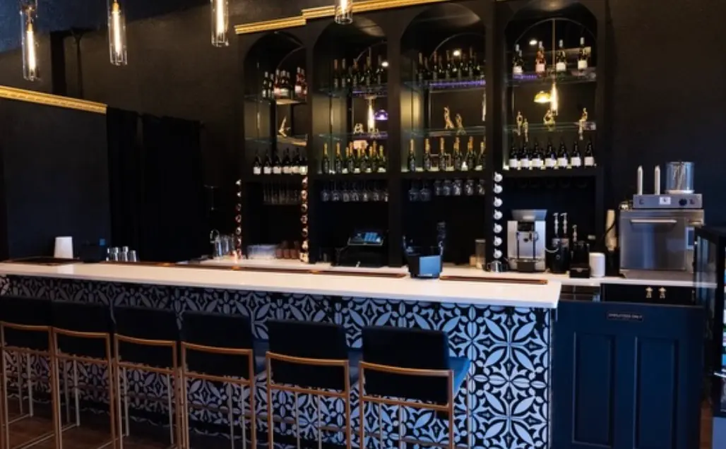The full bar at Babe Coffee Lounge, stocked and lit for a private event in Land O' Lakes, Florida.
