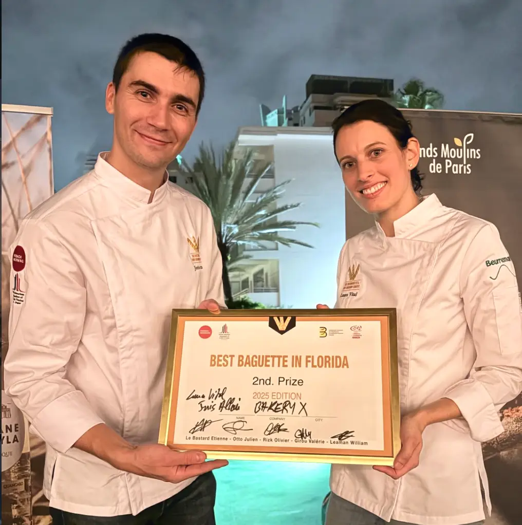 Bakery X chefs holding their Best Baguette in Florida second-prize certificate