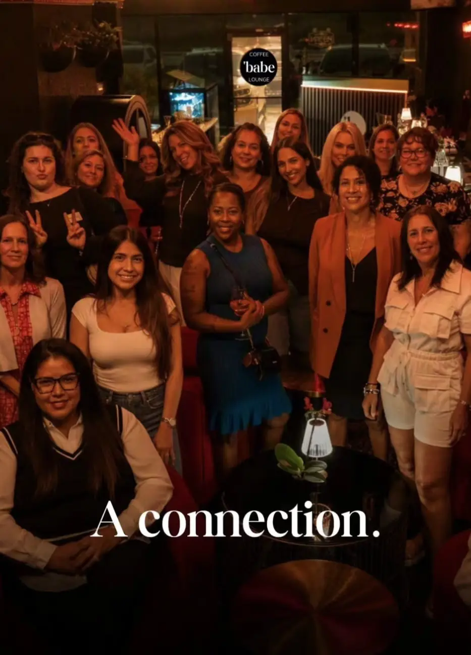 A group of smiling women gathered together during a private shower at Babe Coffee Lounge in Land O' Lakes.
