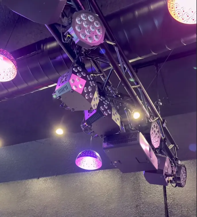 Stage lights and speakers rigged above the Babe stage